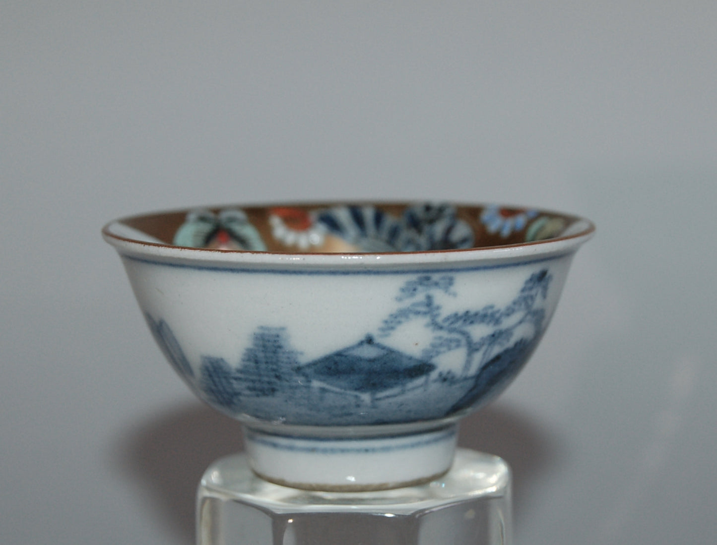 Pair of porcelain sake cups, birds, flowers, butterflies, riverscape, Kutani, Japan