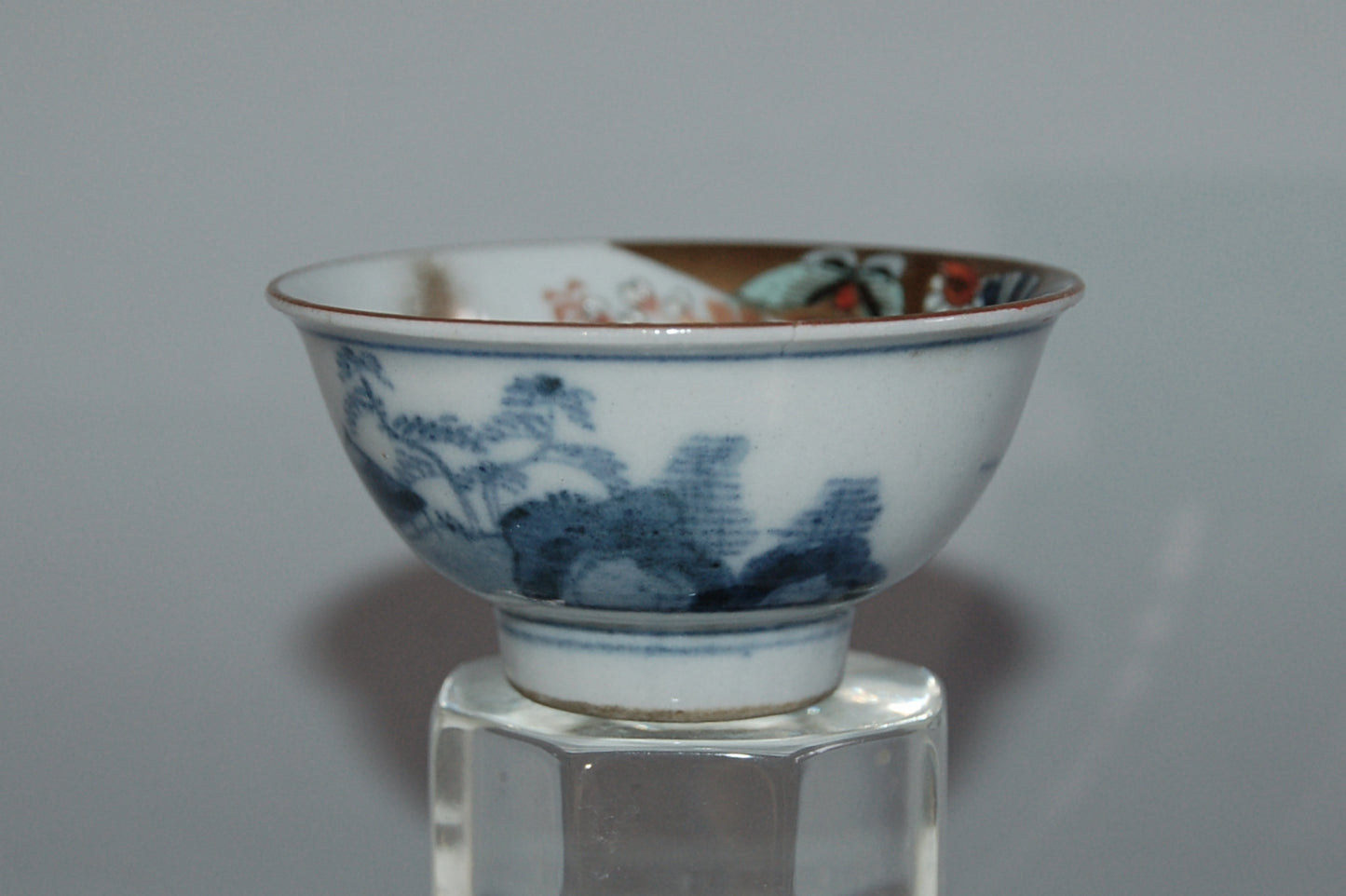 Pair of porcelain sake cups, birds, flowers, butterflies, riverscape, Kutani, Japan