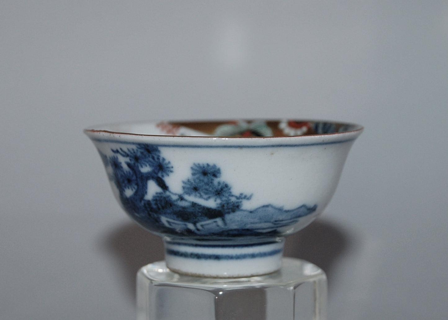 Pair of porcelain sake cups, birds, flowers, butterflies, riverscape, Kutani, Japan