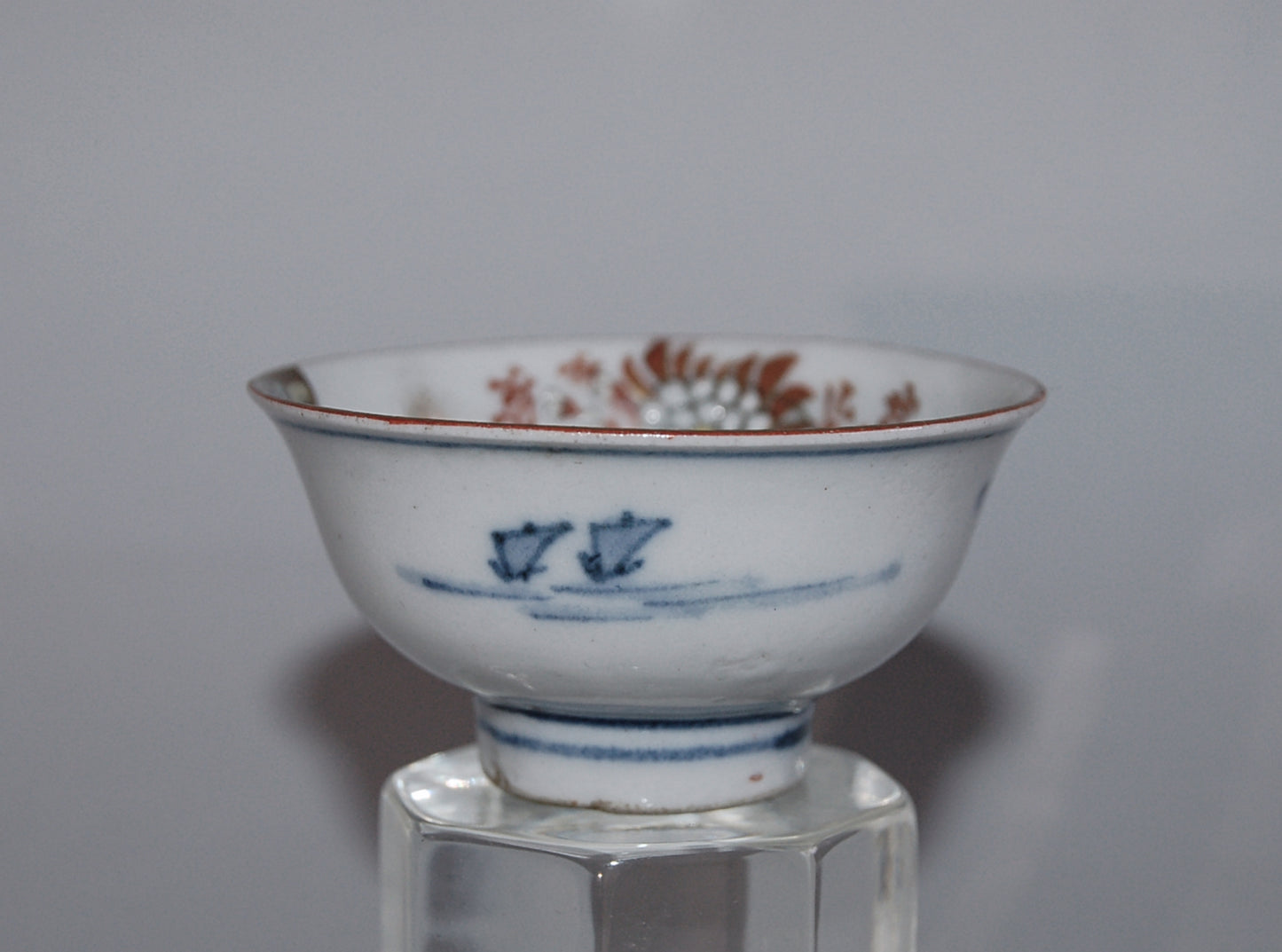 Pair of porcelain sake cups, birds, flowers, butterflies, riverscape, Kutani, Japan