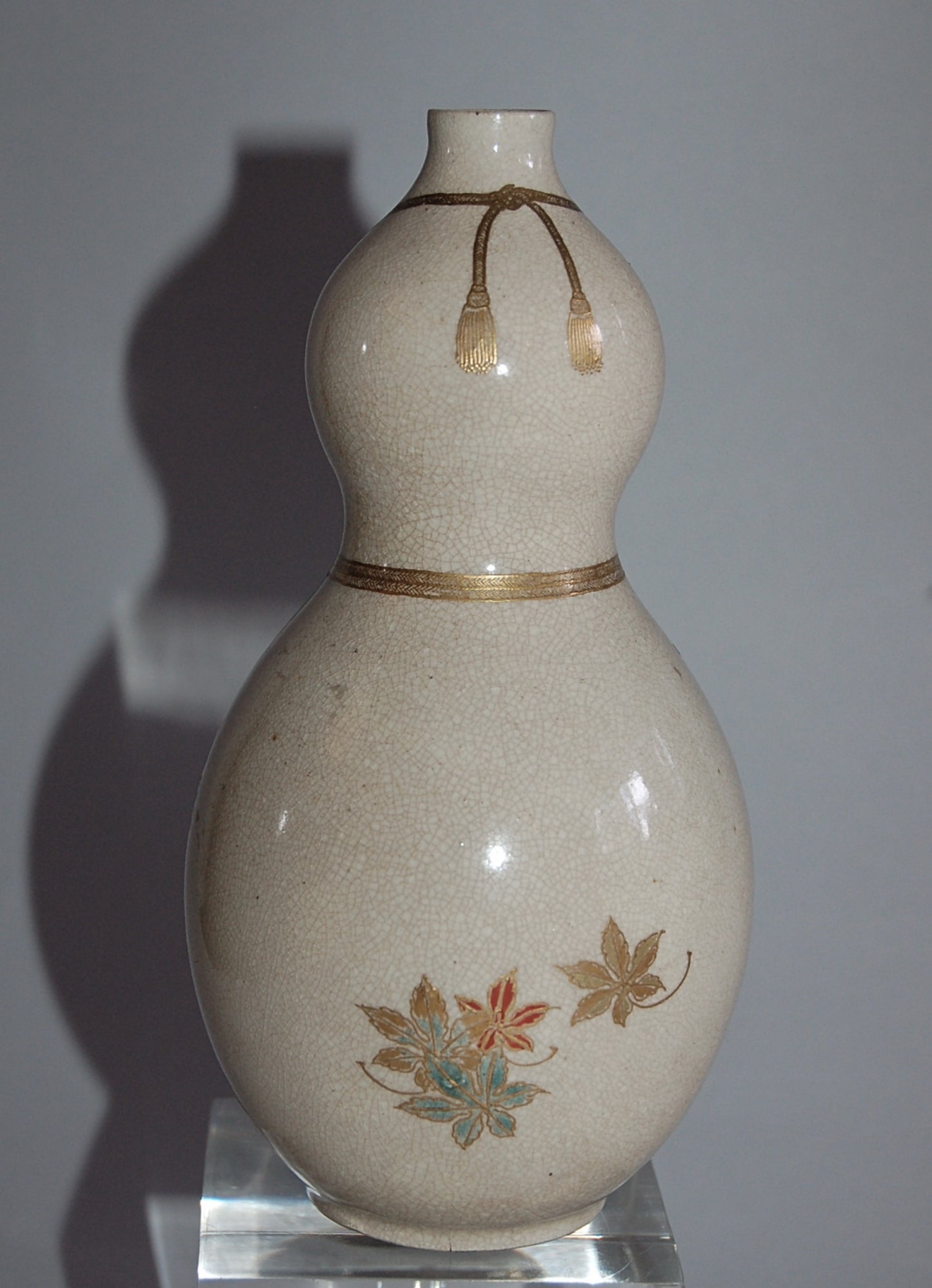 Gourd flask, maple leaves on stream, golden cords and tassels, Kyoto ware, Japan