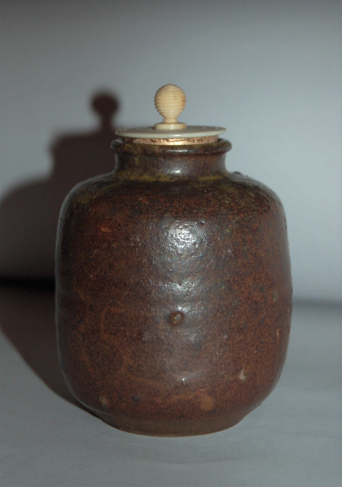 Antique ceramic chaire tea caddy, dark brown glaze, yellow drip, possibly Seto ware, Japan