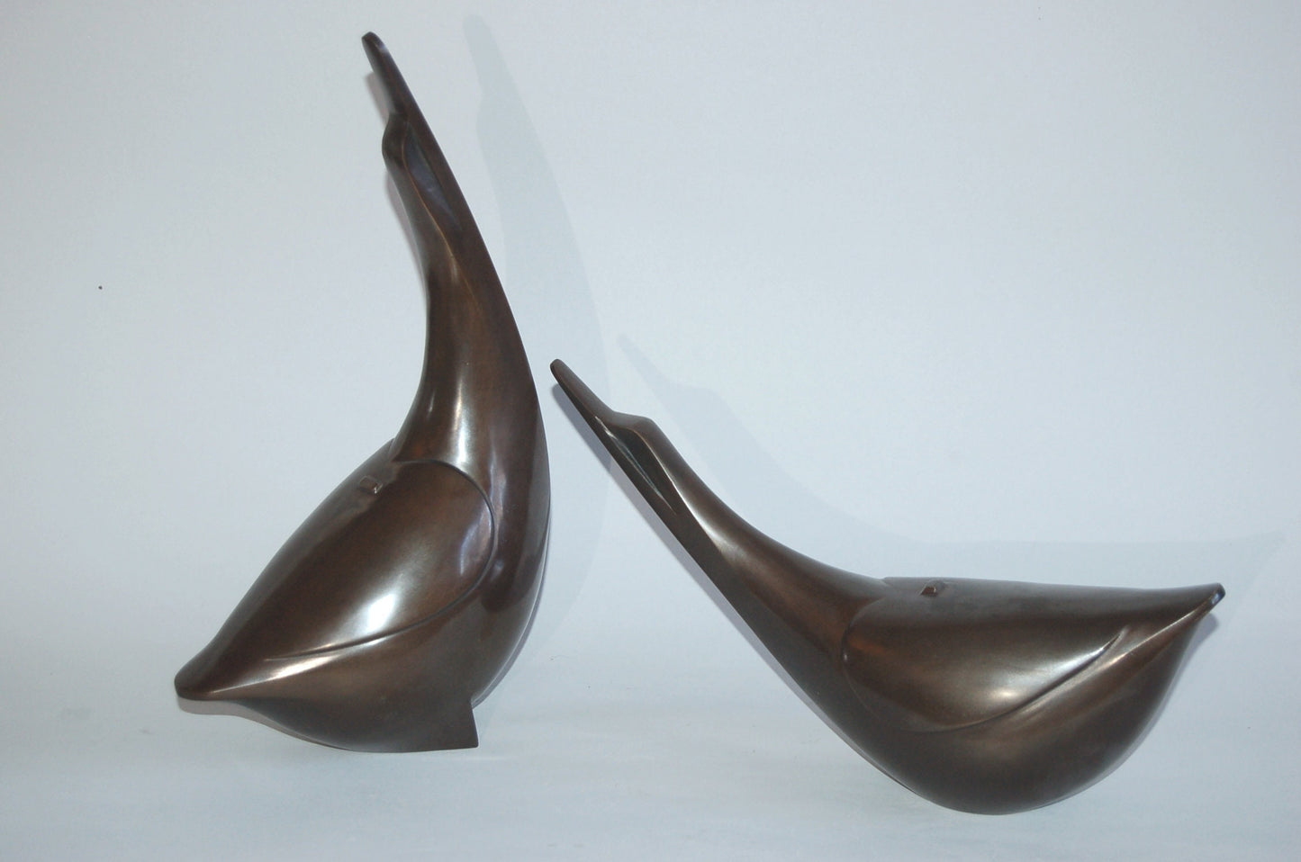 Pair of abstracted geese, dynamic bronze sculpture, by Saegusa Sotaro, Japan